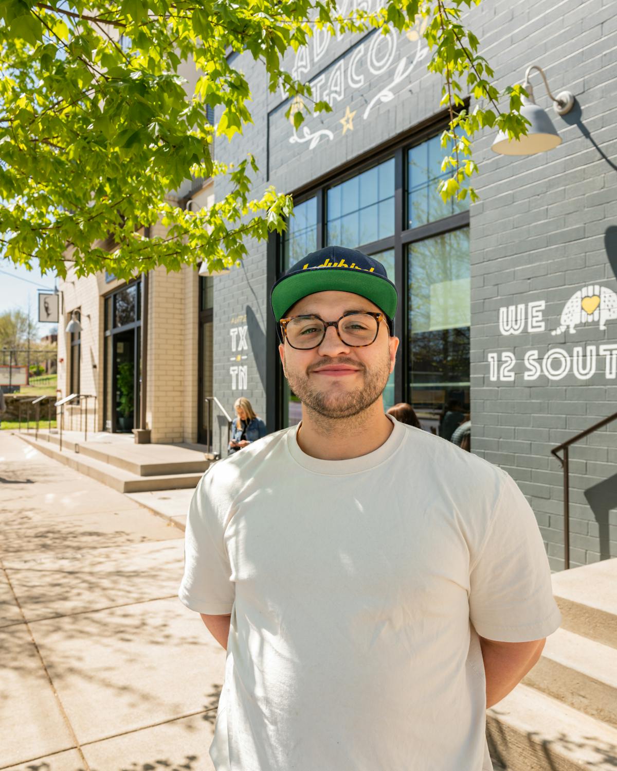 a man standing in front of a building