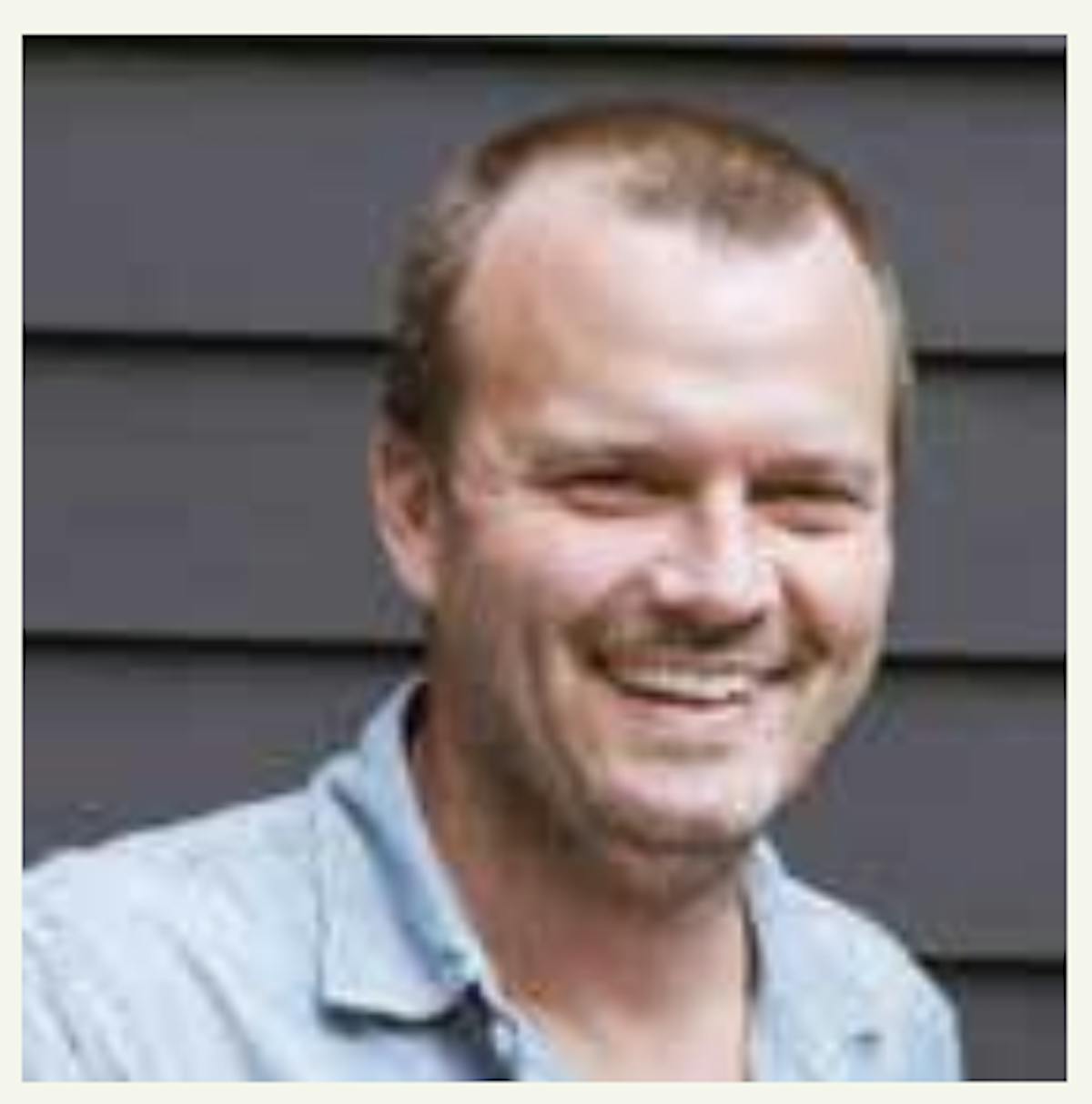 a man smiling for the camera