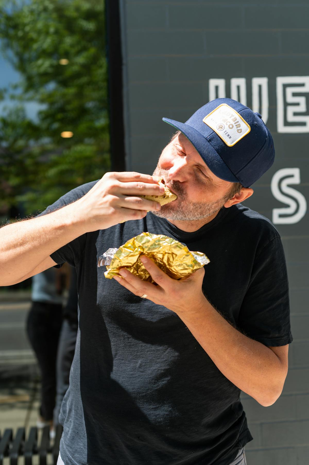 a person eating a sandwich