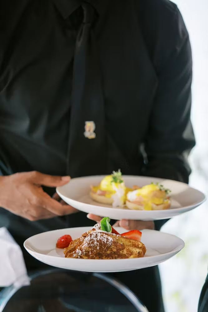 a server holding plates