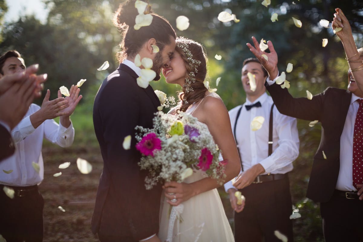 a couple of people that are standing in a wedding dress