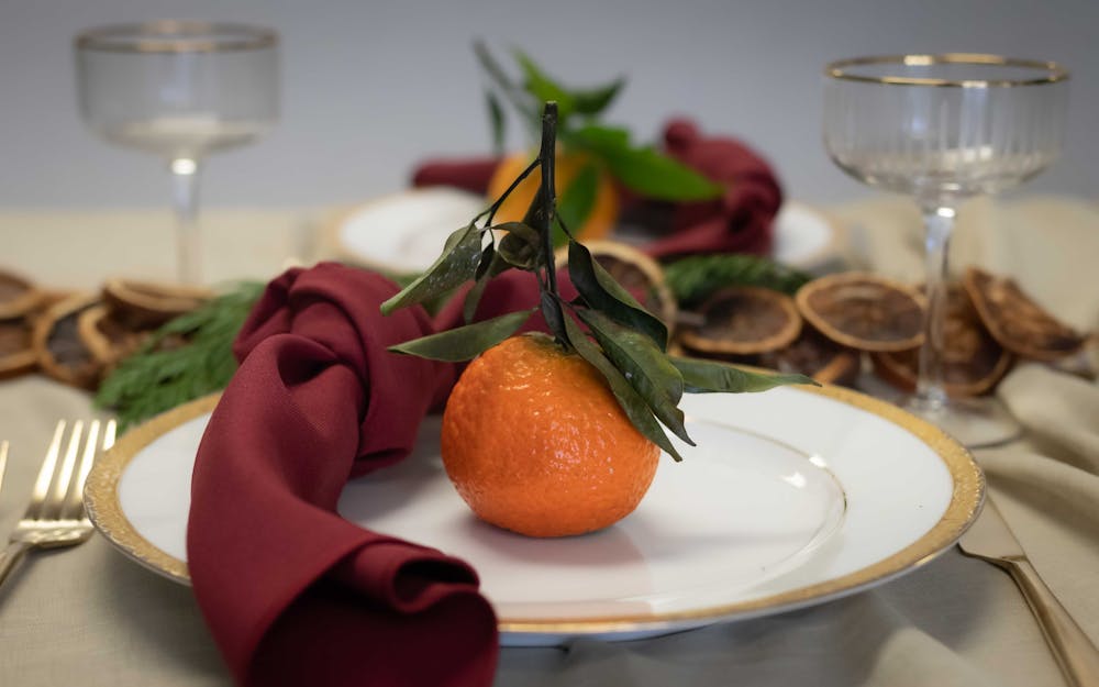 a plate of food and glasses of wine on a table