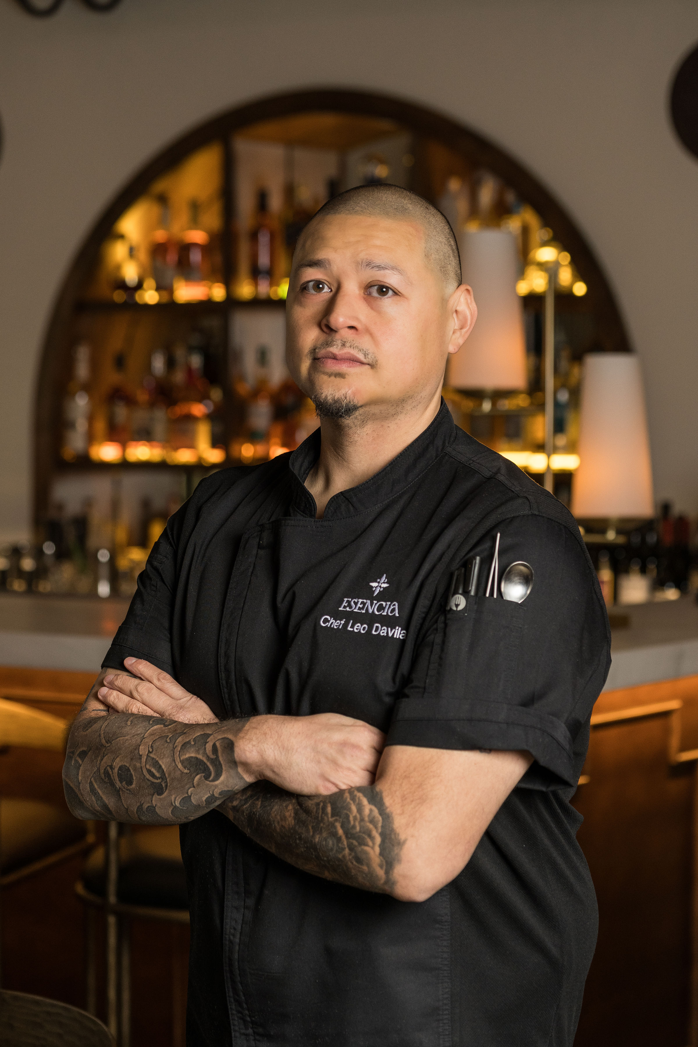 a man with tattoos on his arms