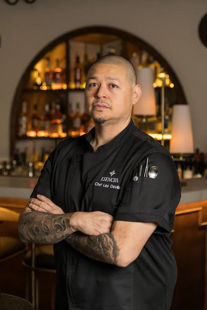 a man with tattoos on his arms