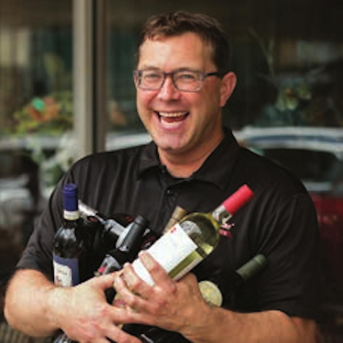 a man holding a wine glass