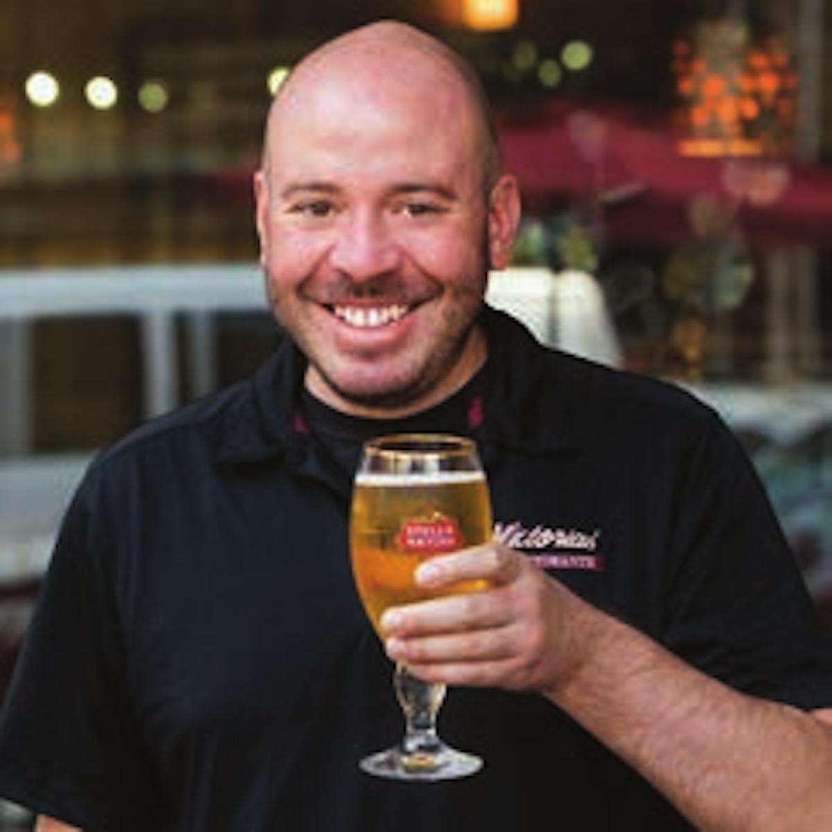 a man holding a glass of wine