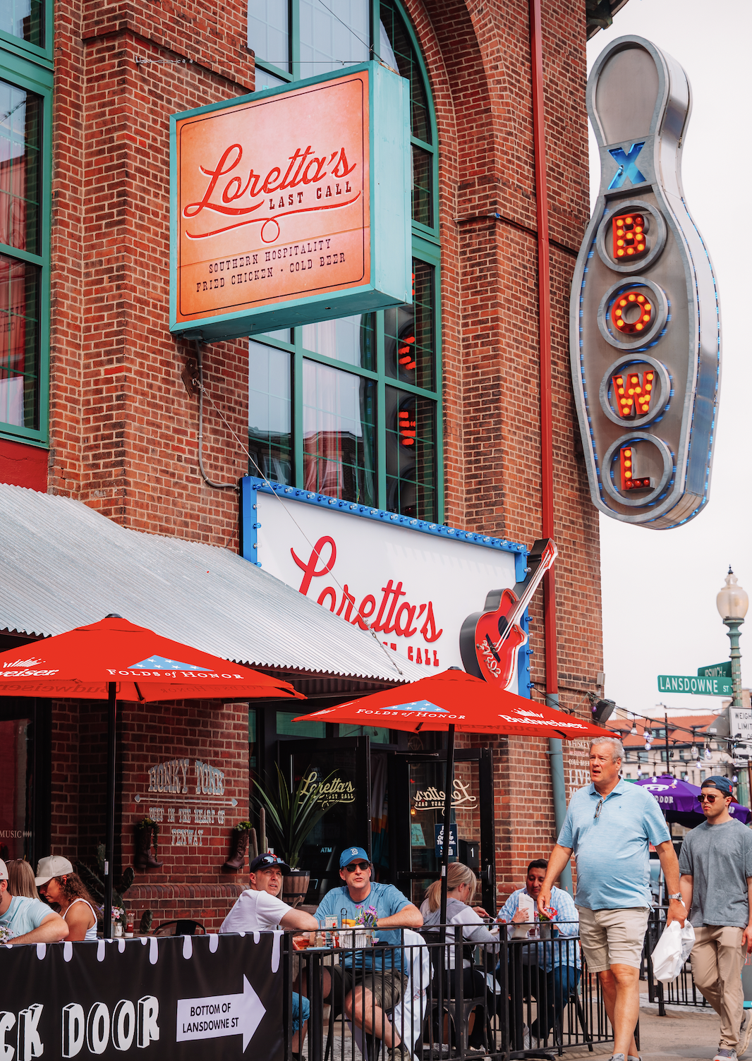 a group of people standing in front of a building