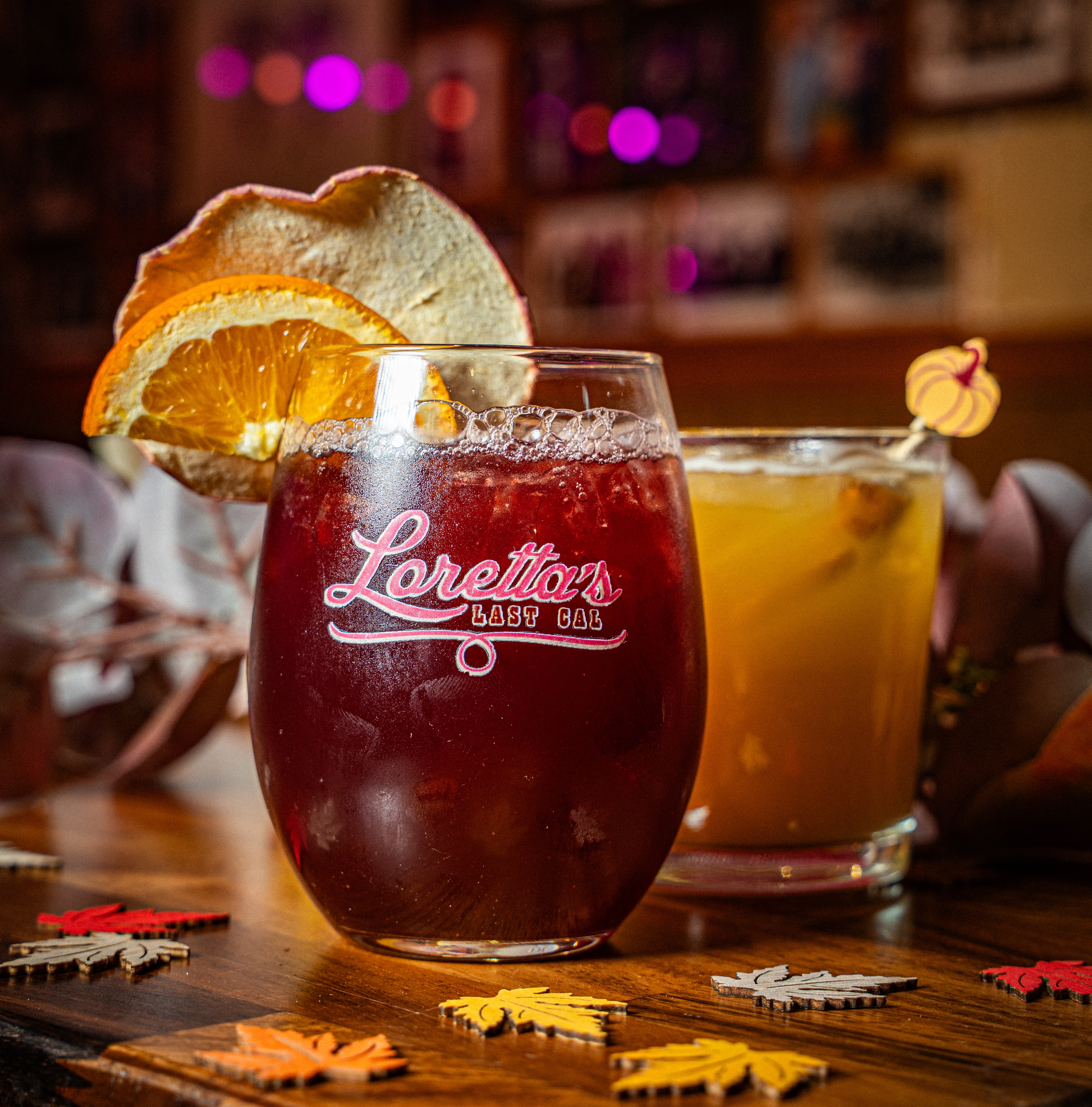 a close up of a glass of beer on a table