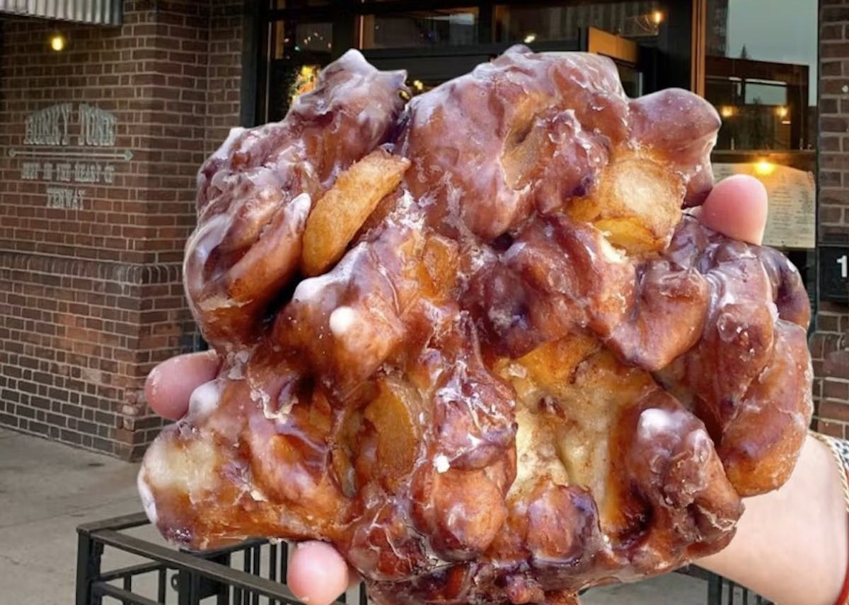 a person holding a donut