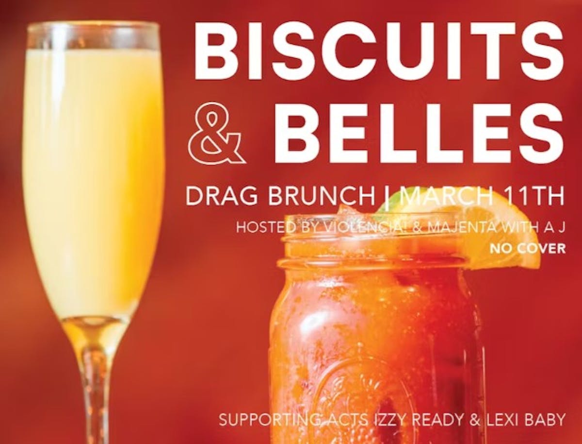 a close up of a bottle and a glass of wine