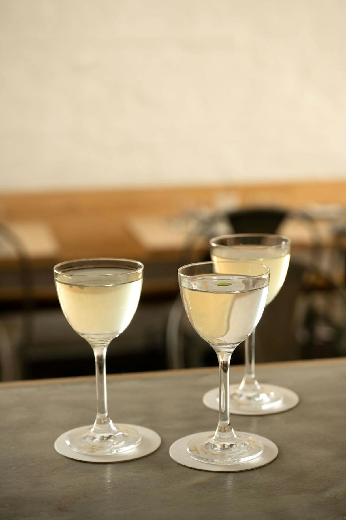 an empty wine glass sitting on a table