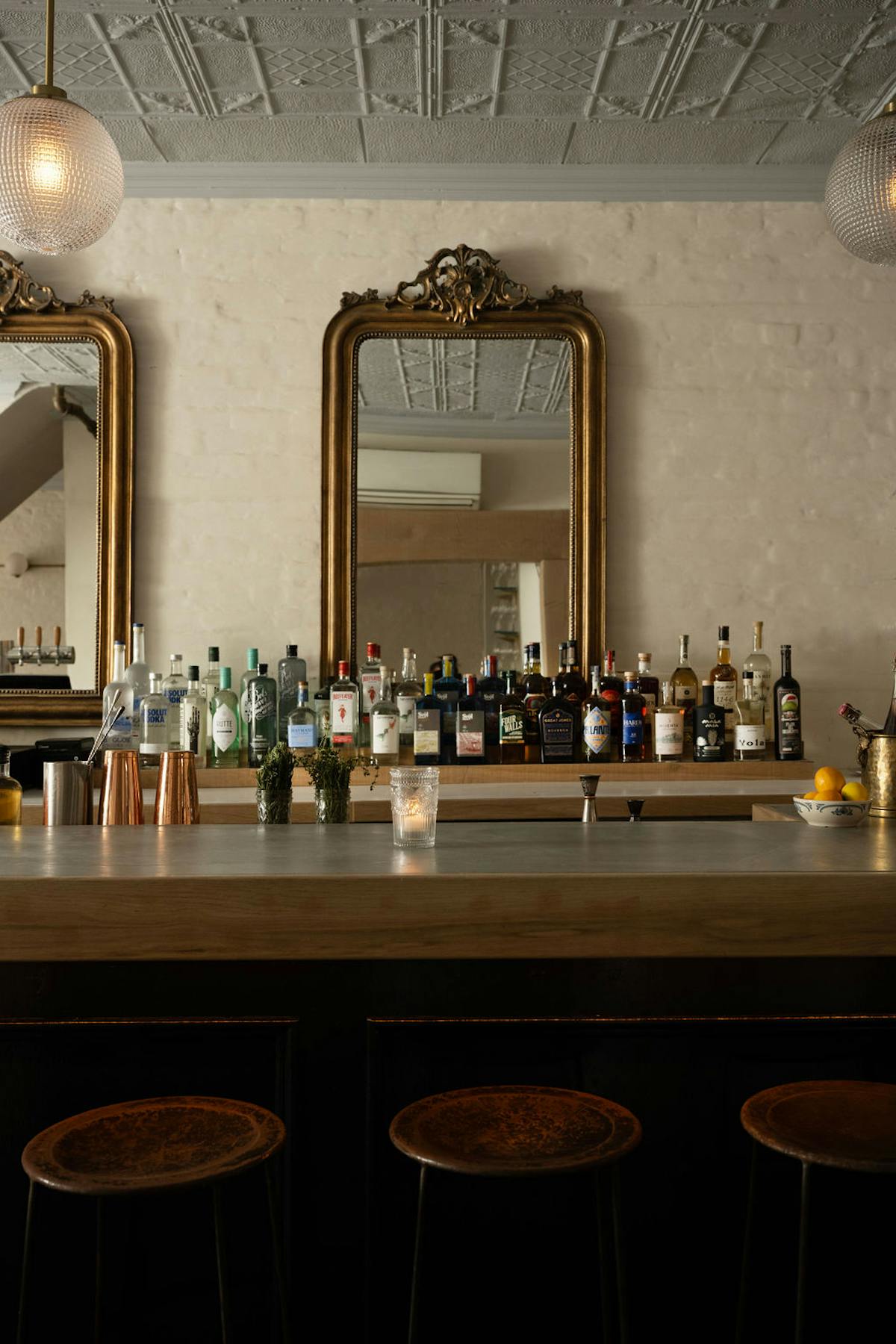 a kitchen with a sink and a mirror