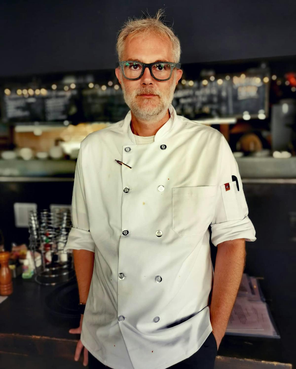 a man standing in a kitchen