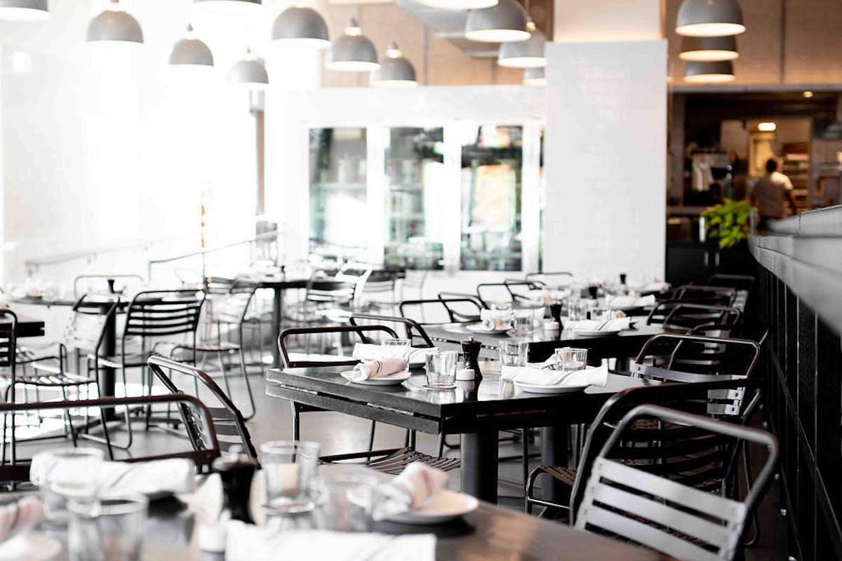 a dining room table in front of a building