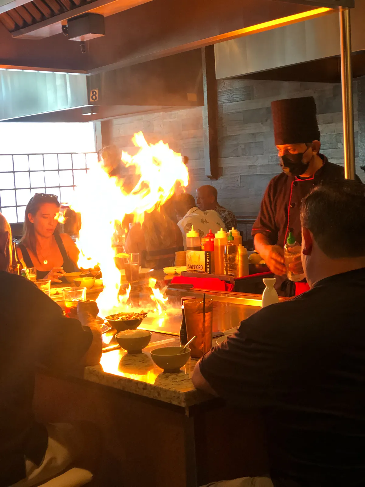 a group of people standing around a fire