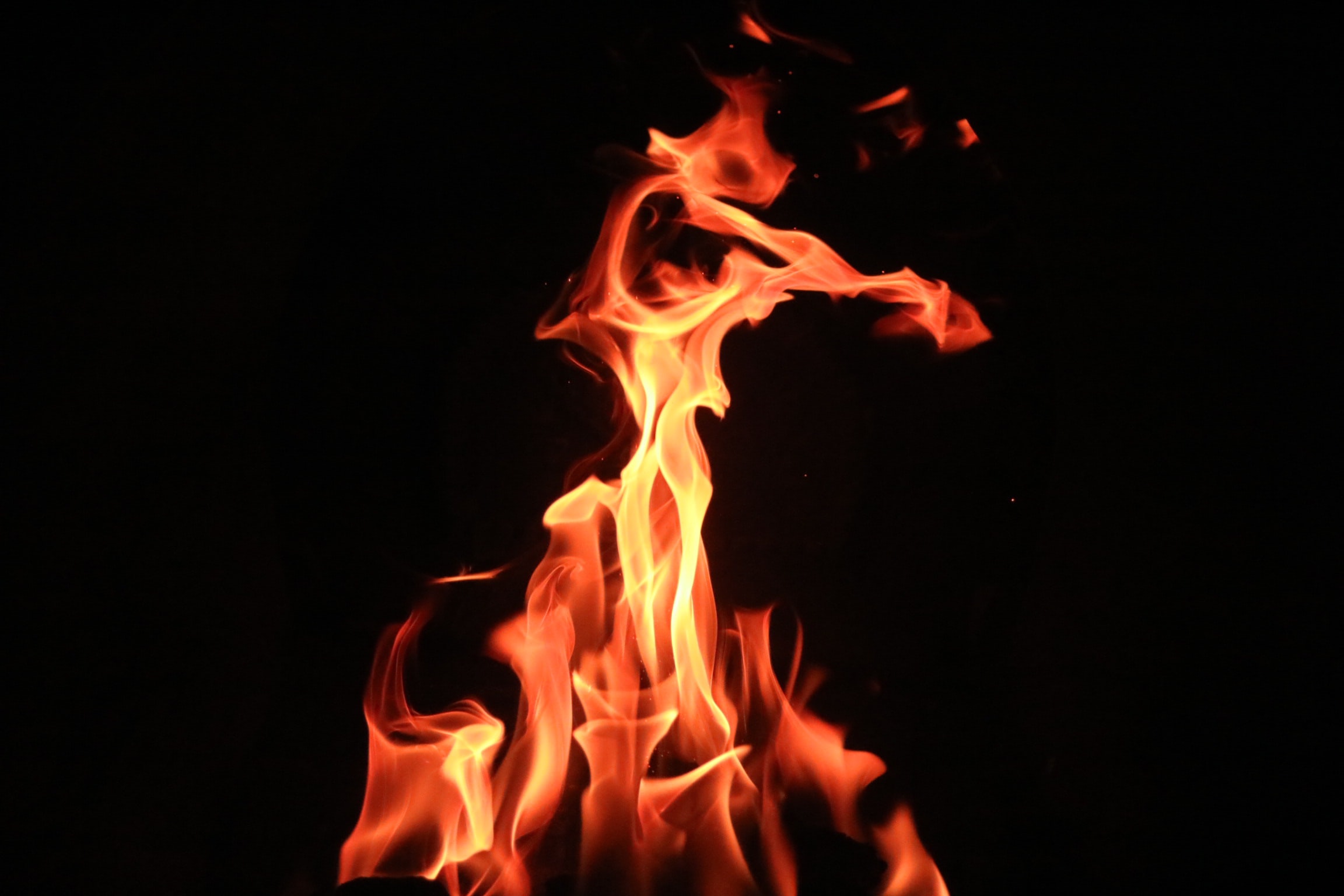 a fire burning in a dark room