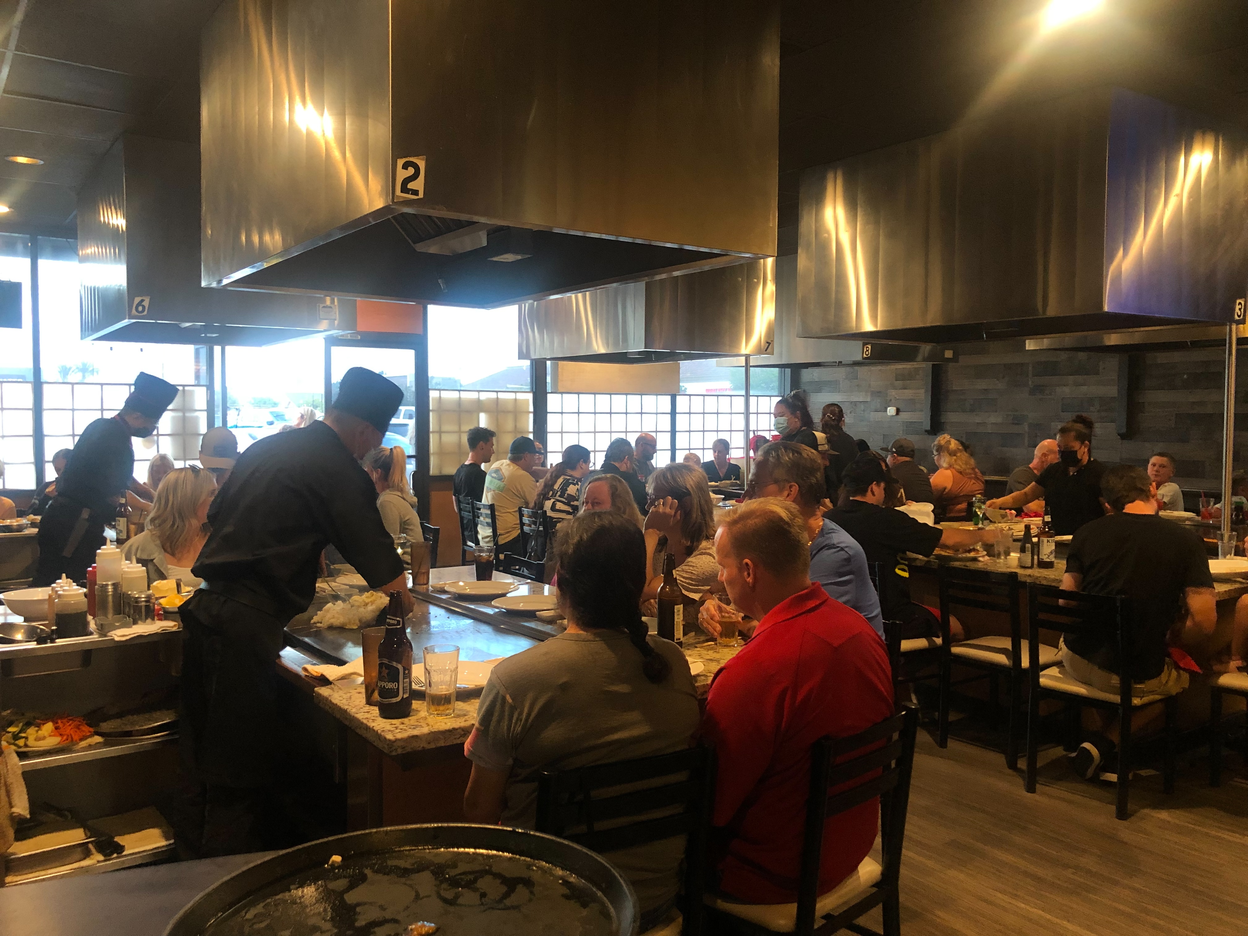 a group of people preparing food in a restaurant