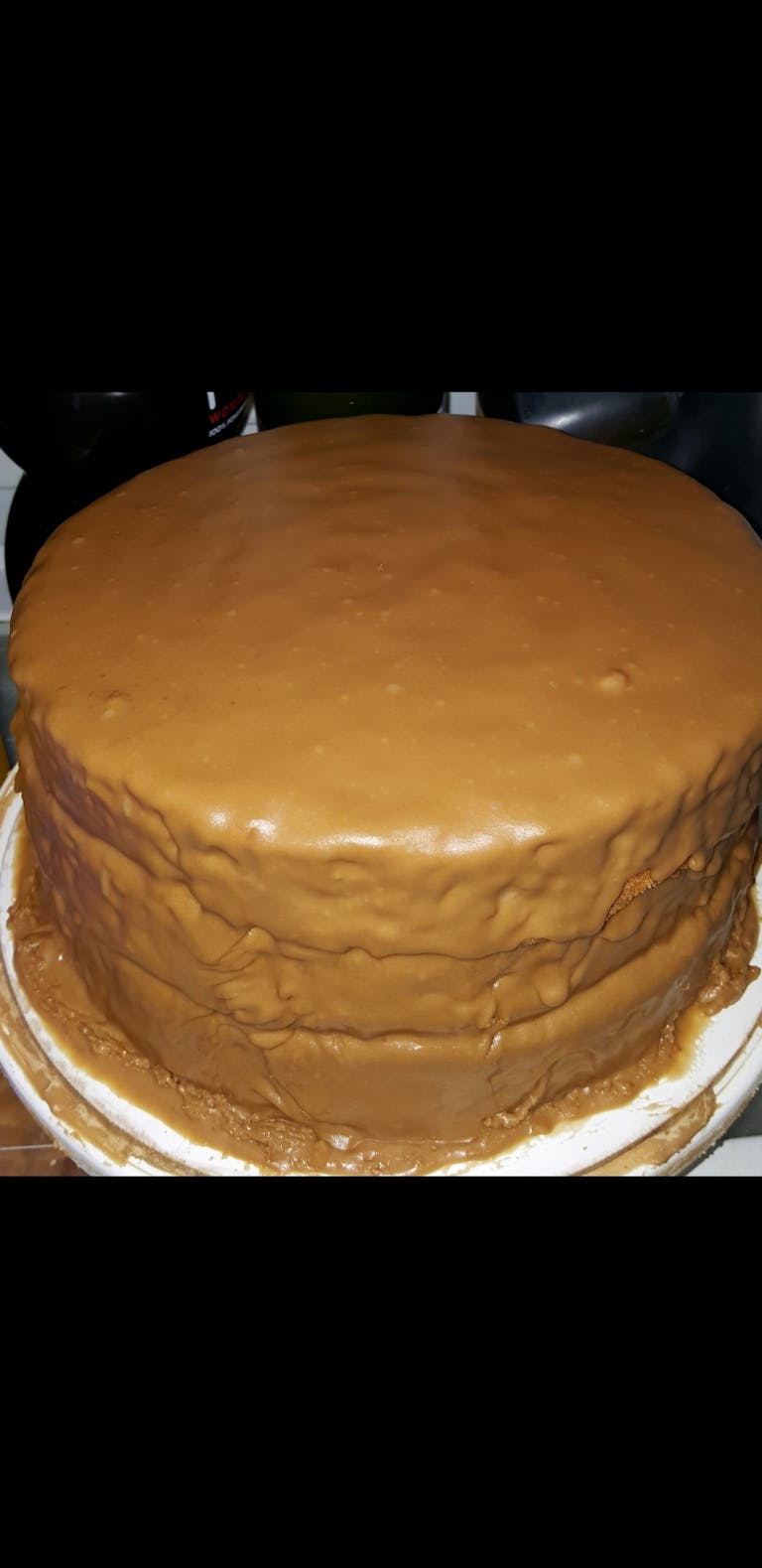 a large chocolate cake sitting on top of a table