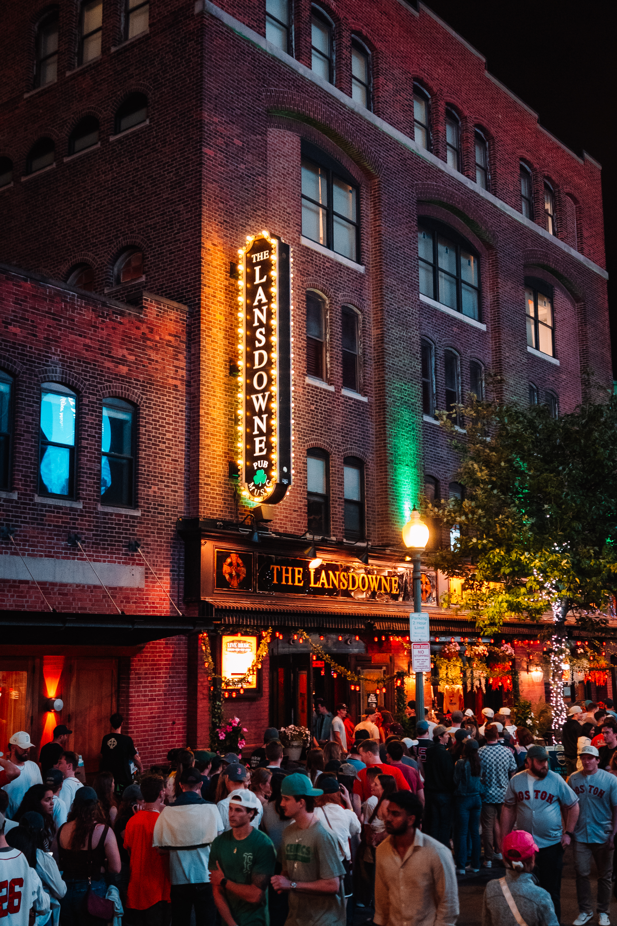 a group of people walking on a city street