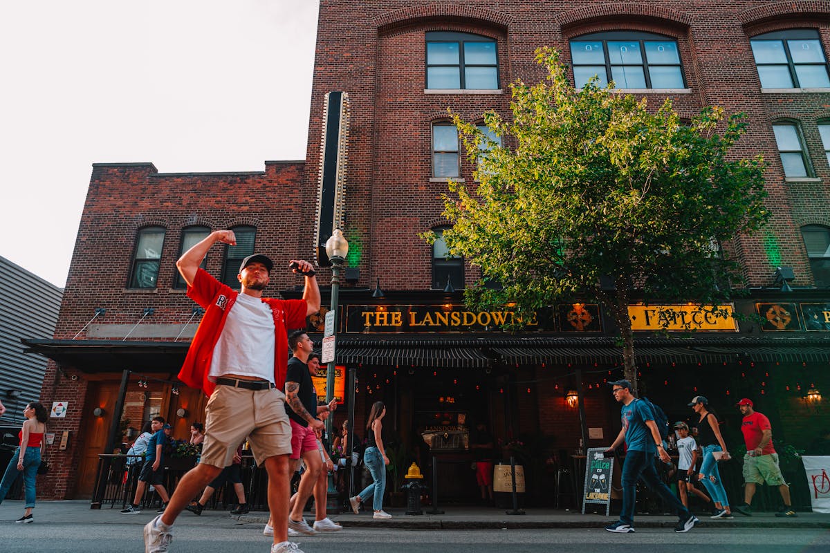 a group of people walking in front of a building