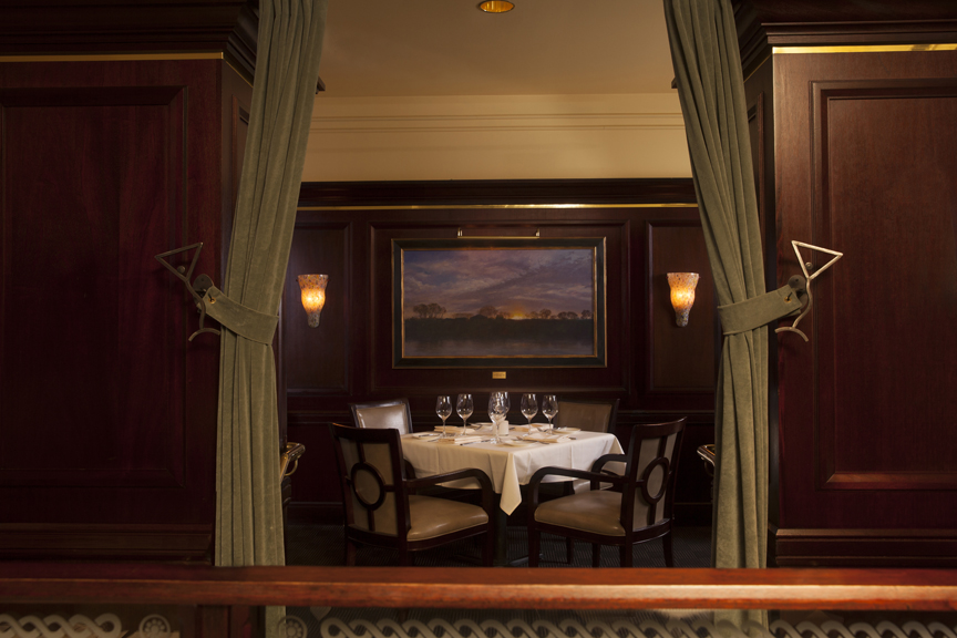 a room with a fireplace and a large window