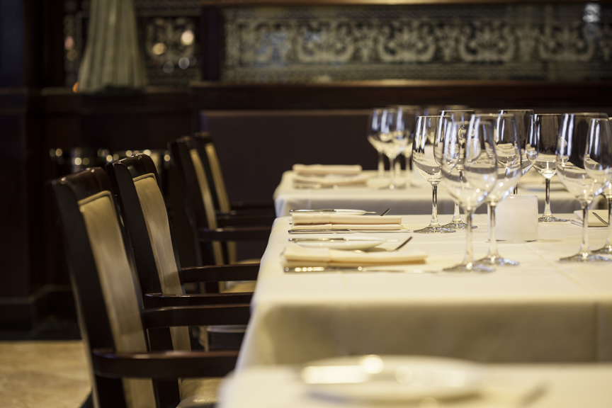 a dining table with wine glasses