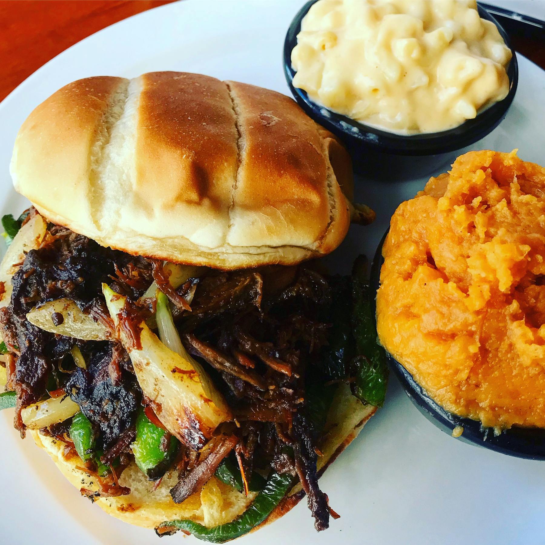 a sandwich and two sides on a plate