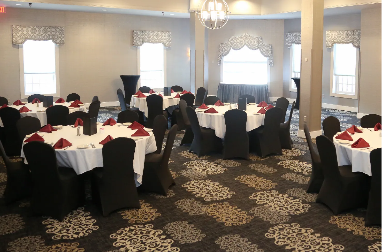 Combined Banquet Rooms A-B-C largest event space with round tables, seats 100+ guests
