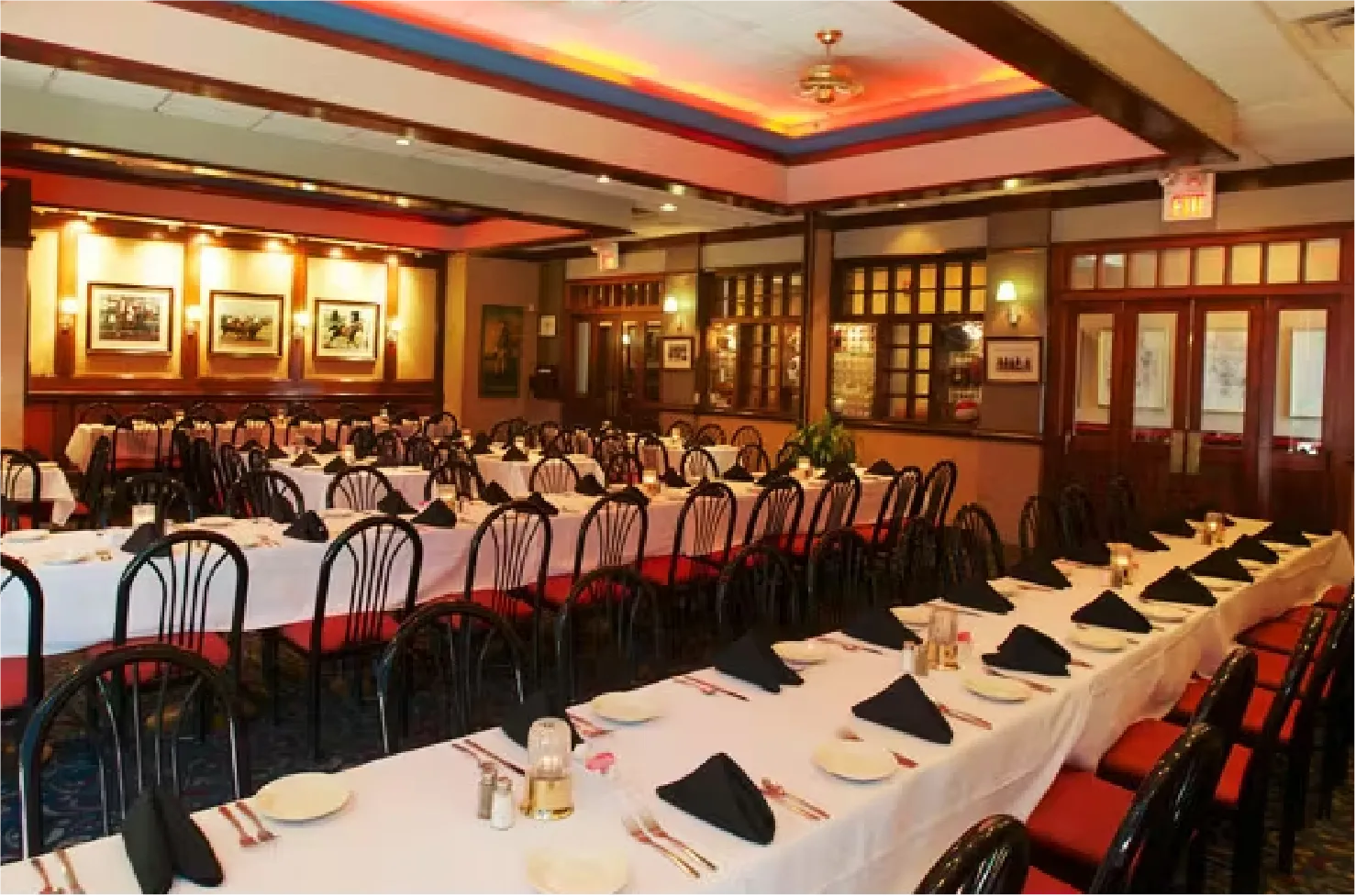 Turf Room B horse racing-themed private dining space with long banquet tables