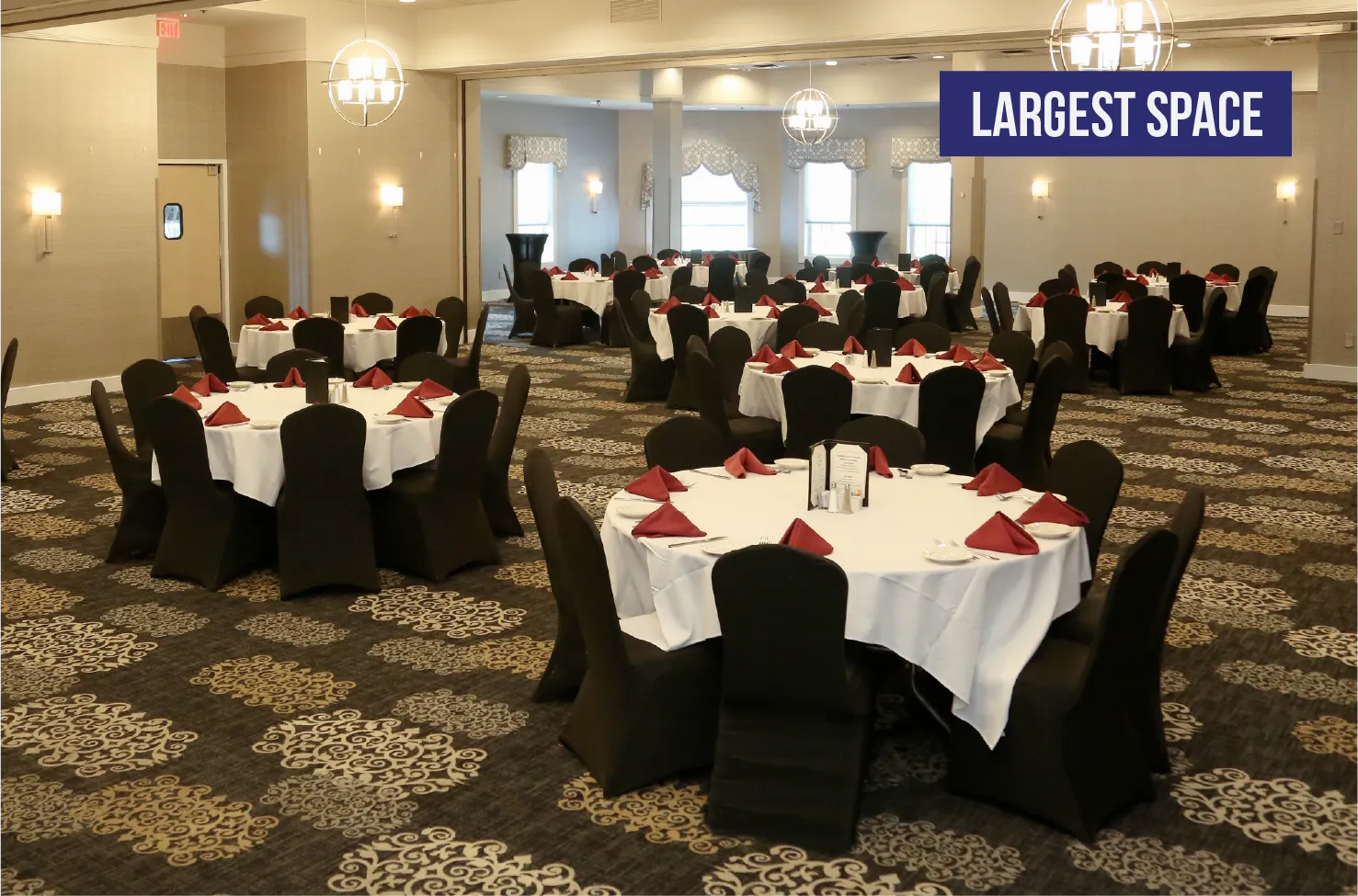 Combined Banquet Rooms A-B-C largest event space with round tables, seats 100+ guests