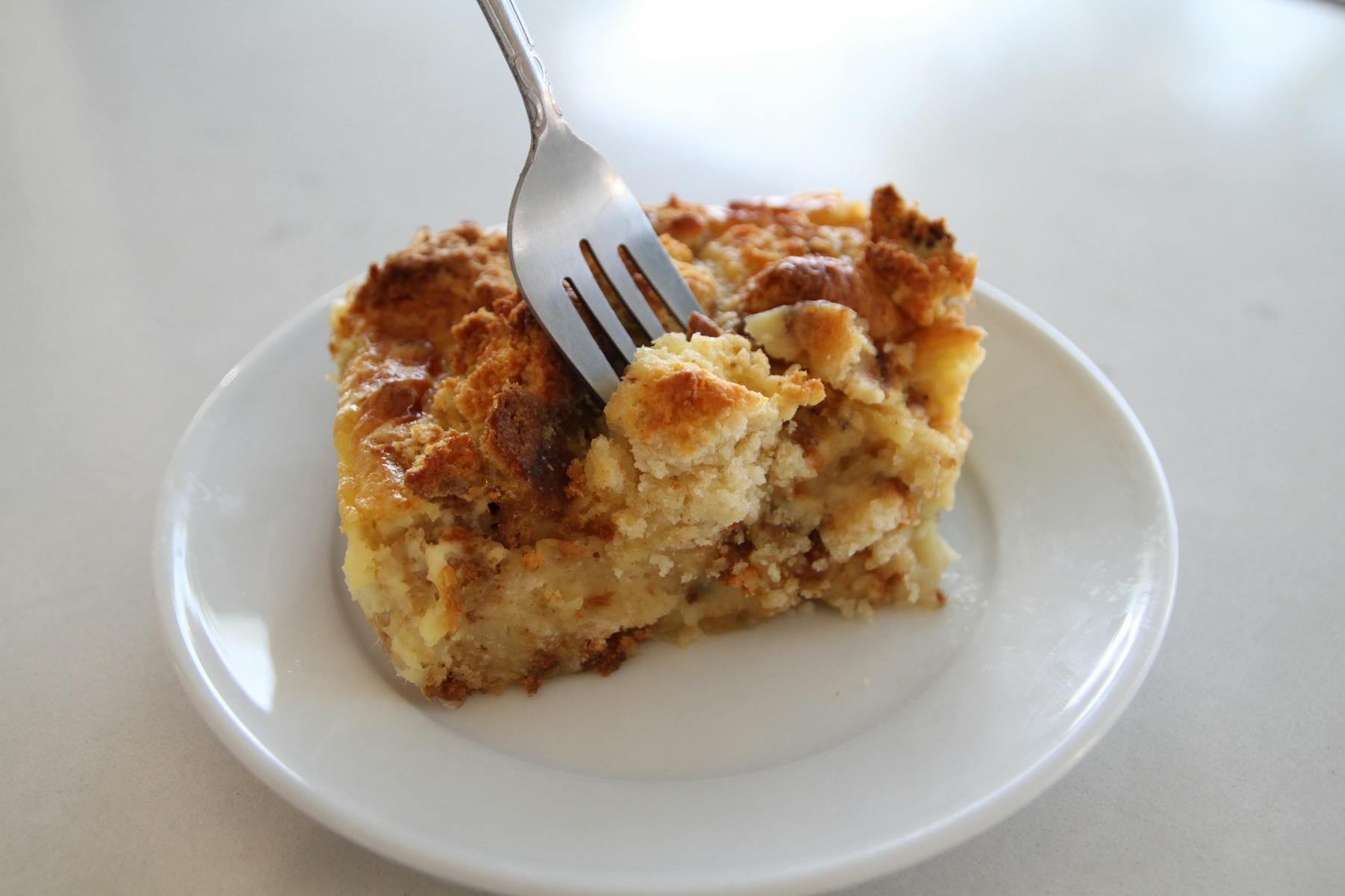 a piece of cake on a plate with a fork