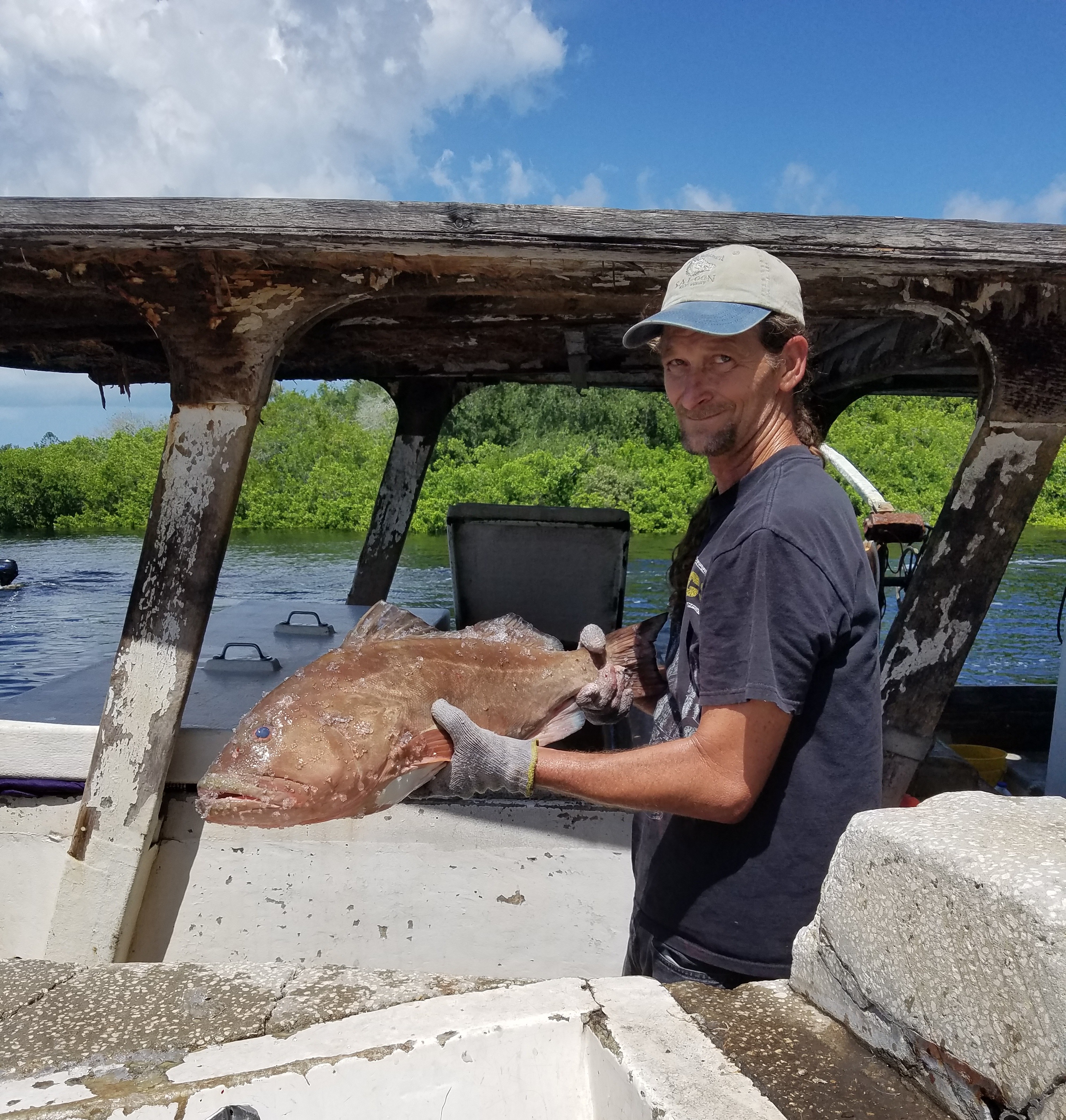 a man holding a big fish