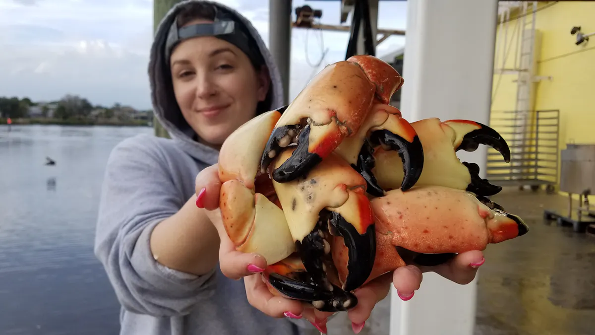 a woman holding a crab claw