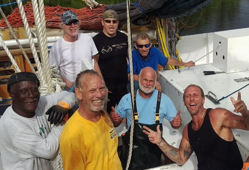 a group of people smiling for the camera