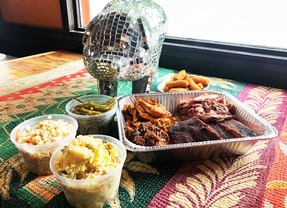 a group of people sitting at a table posing for the camera