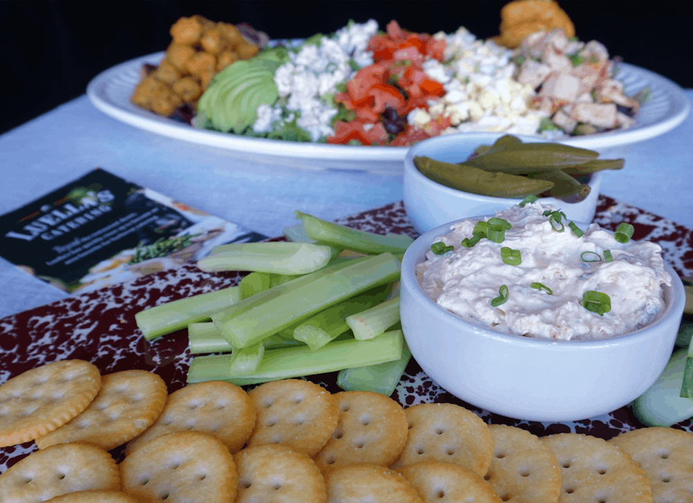 a group of people preparing food on a table