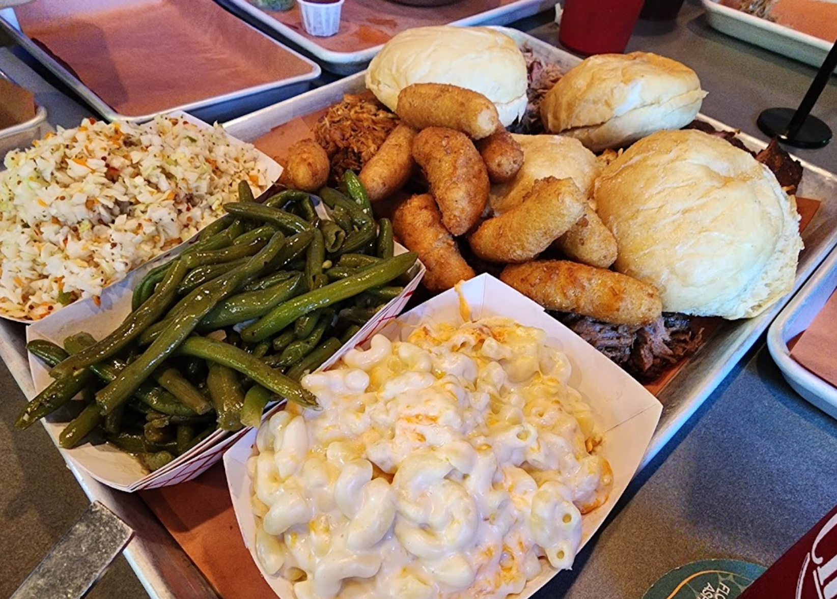 a person sitting at a table with a plate of food