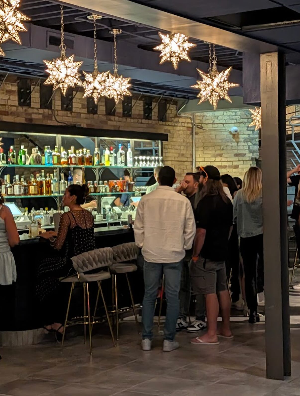 a group of people standing in front of a store