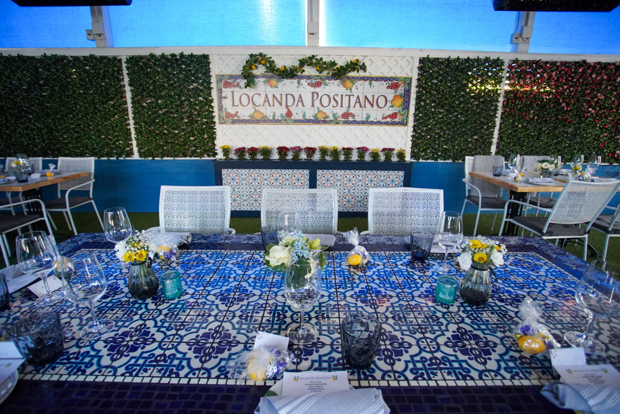 a table topped with a blue umbrella