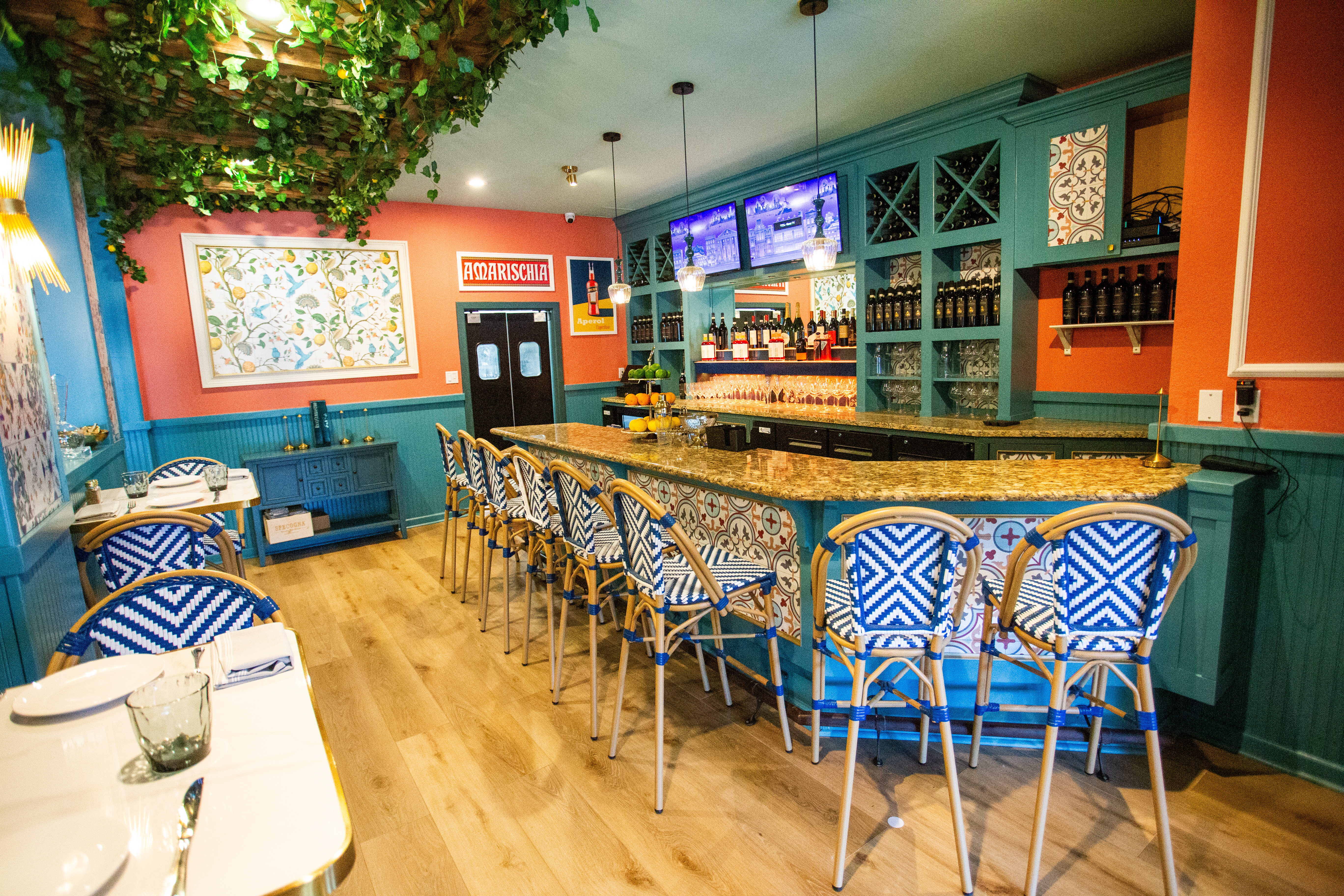 a bar with chairs and a table