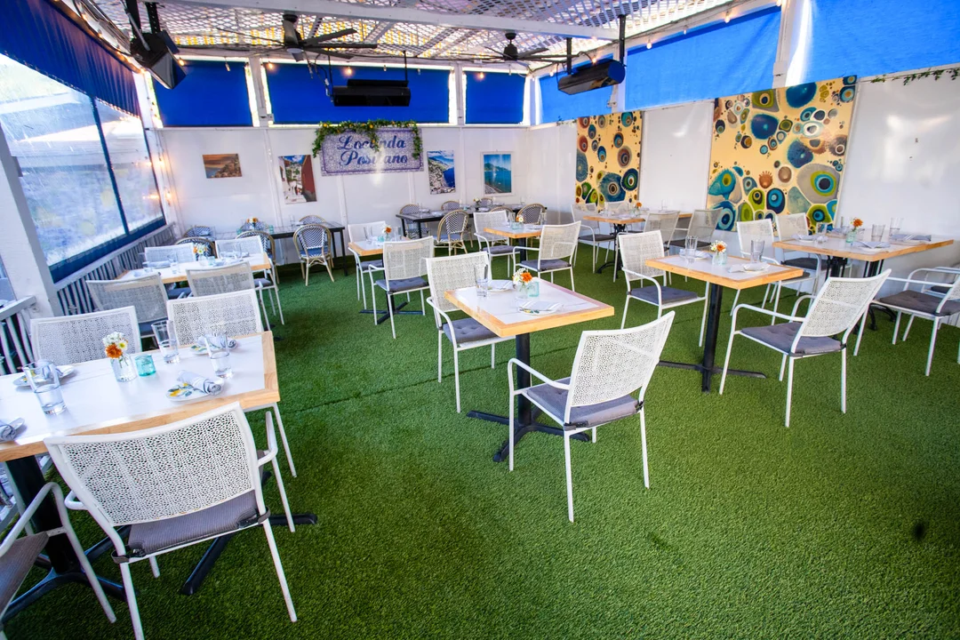a restaurant full of tables and chairs