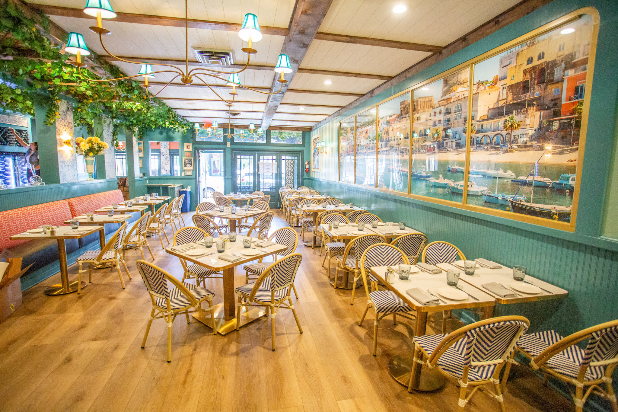a group of people sitting at a table in front of a store