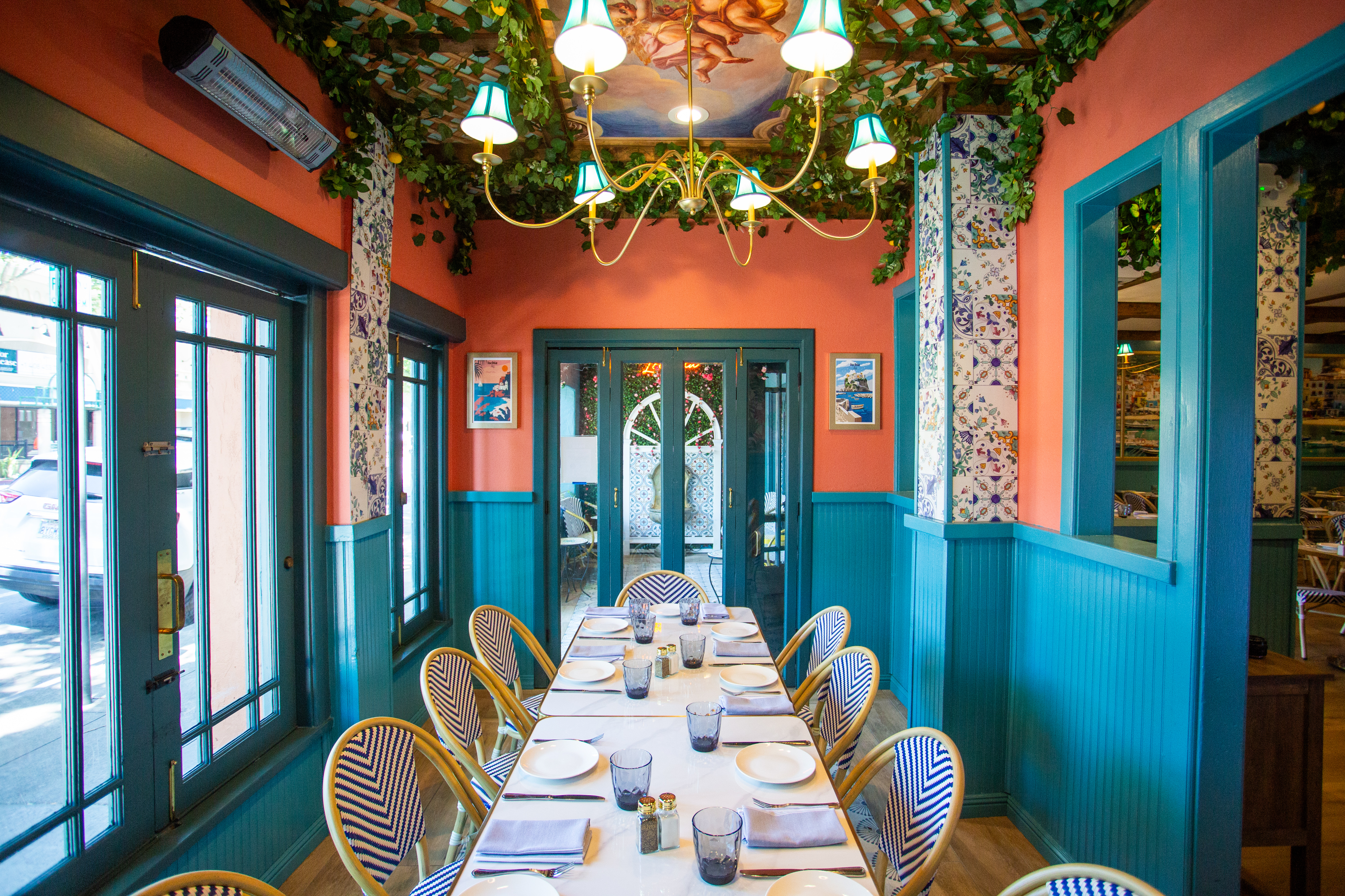 a dining room with a table and chairs