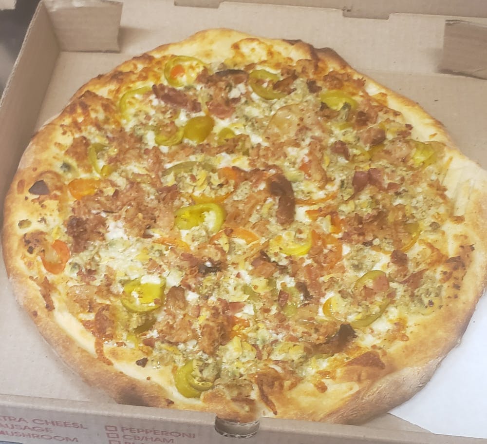 a pizza sitting on top of a box