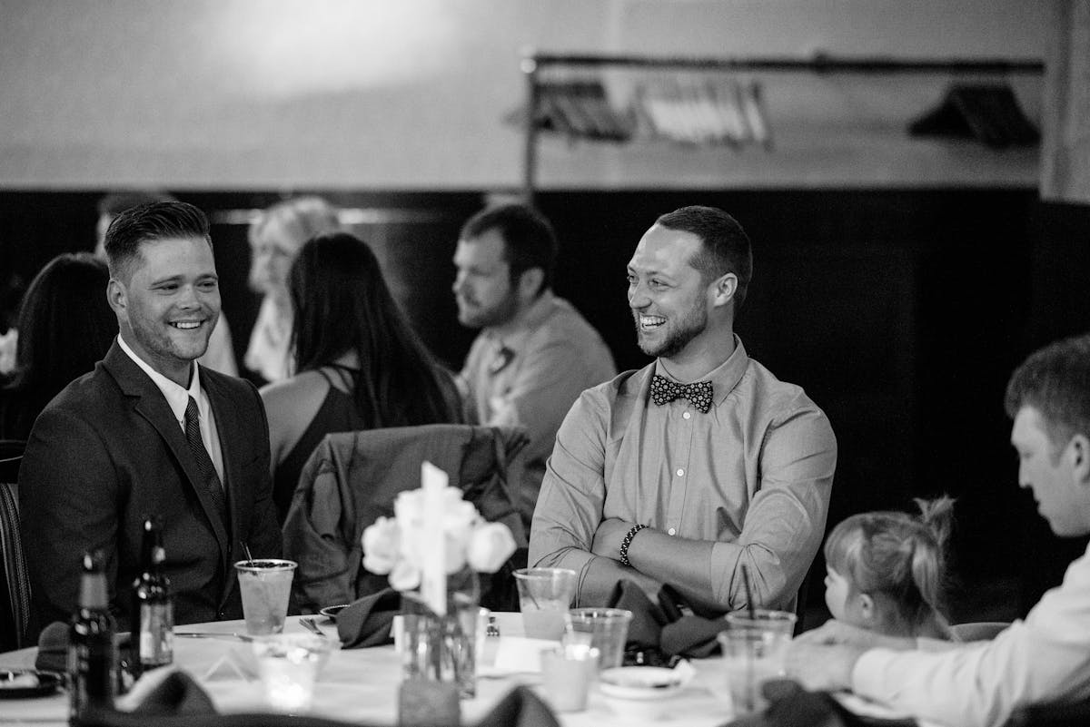 a group of people sitting at a table