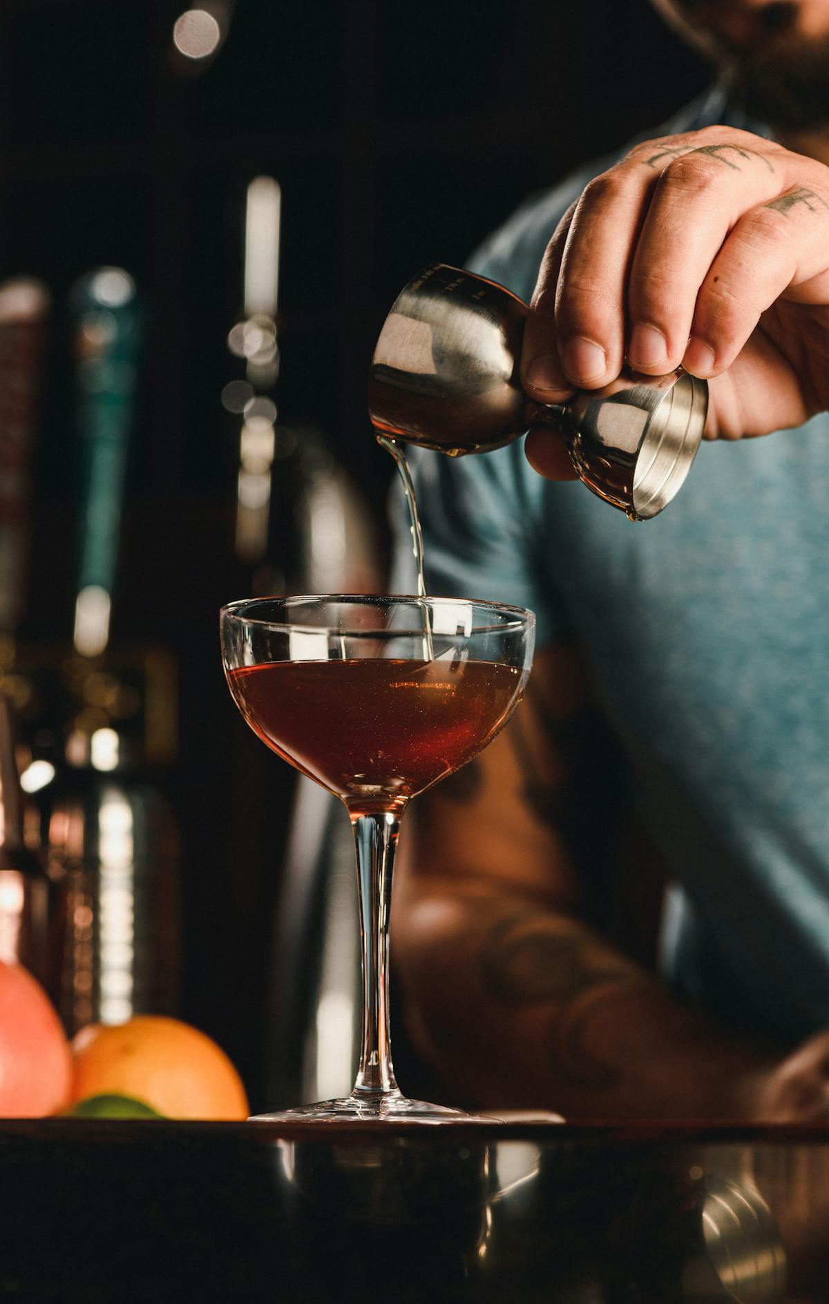 a hand holding a glass of wine