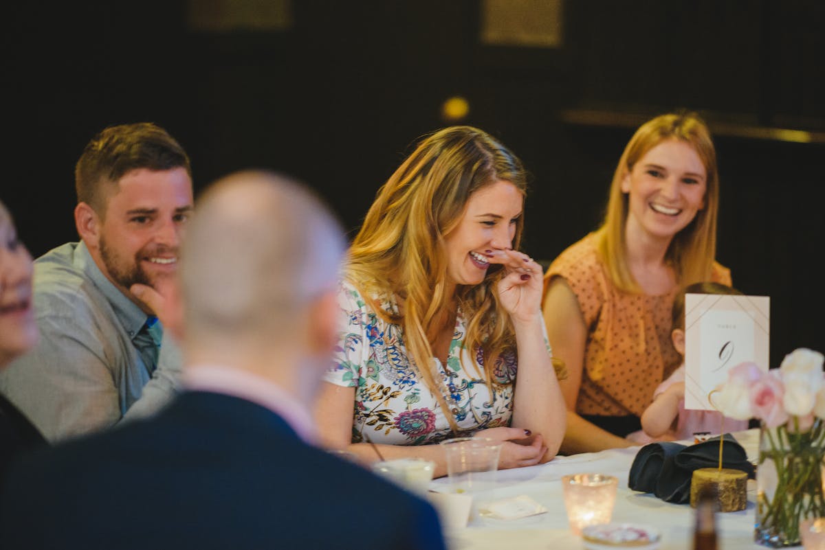 a group of people sitting at a table