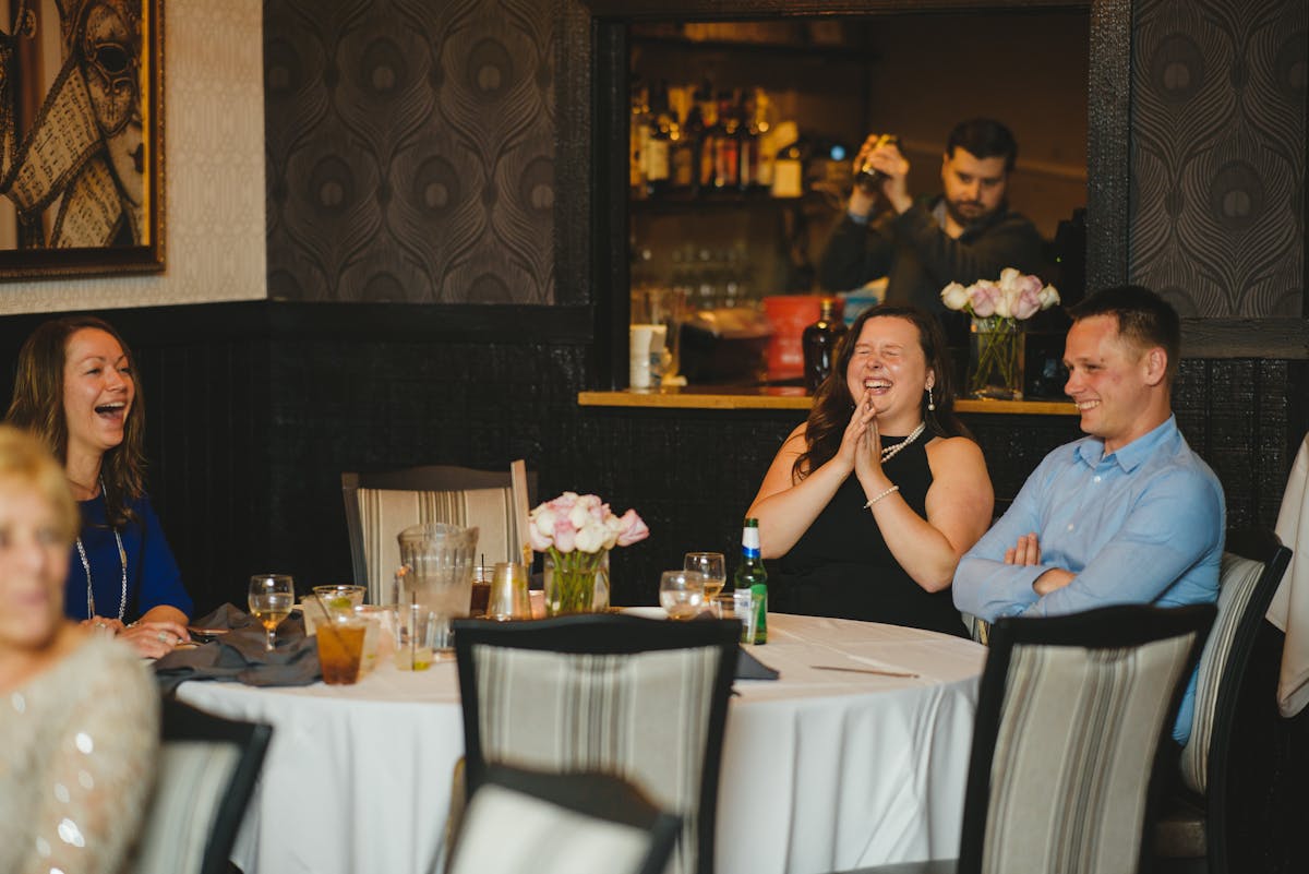 a man and a woman sitting at a table in a restaurant