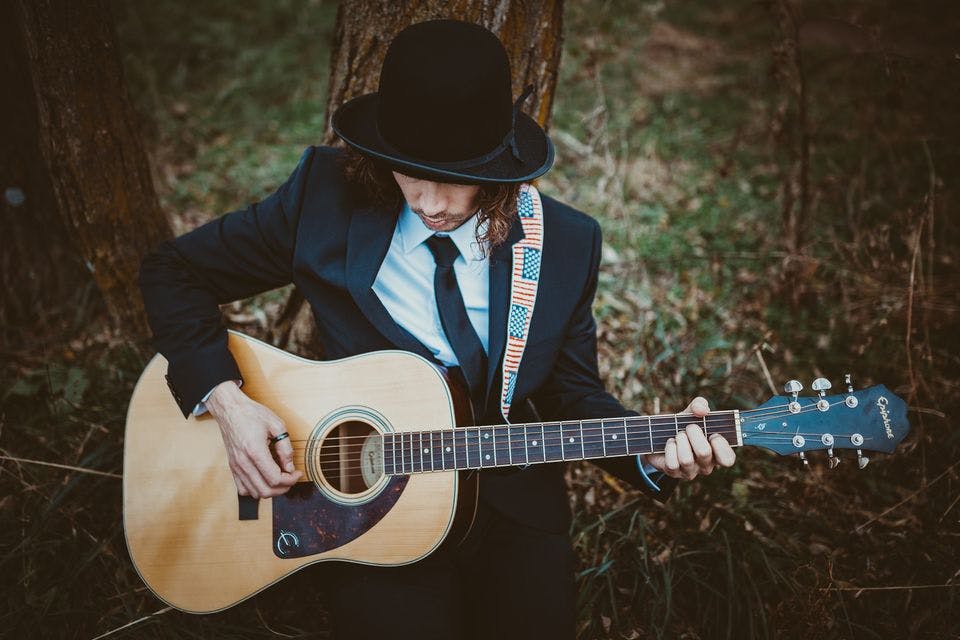 a person holding a guitar