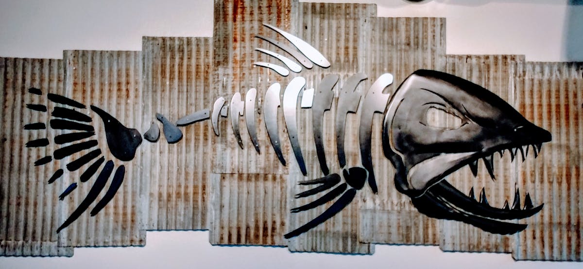 metal fish in wall